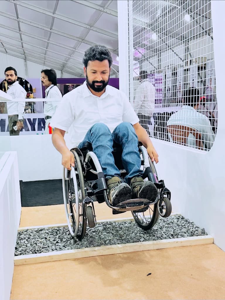 Mohammad Imran demonstrating rough terrain and loose gravel obstacle negotiation on a wheelchair testing track