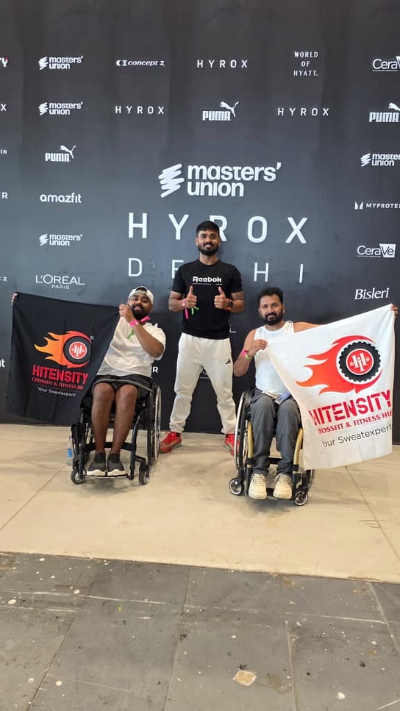 Mohammad Imran with fellow wheelchair athlete and coach celebrating unity at HYROX Delhi