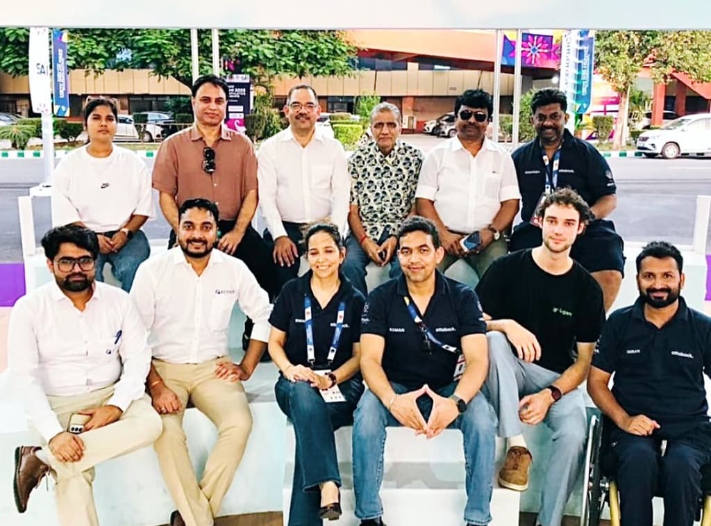 Mohammad Imran with organizers, coaches, and athletes at a national para athletics sports event